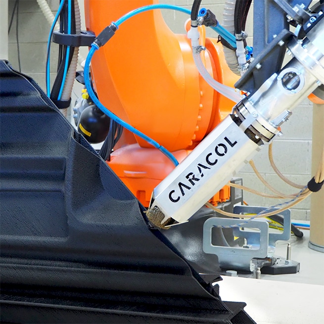 Caracol Heron AM robotic large-format 3D printer depositing fibre-reinforced composite material